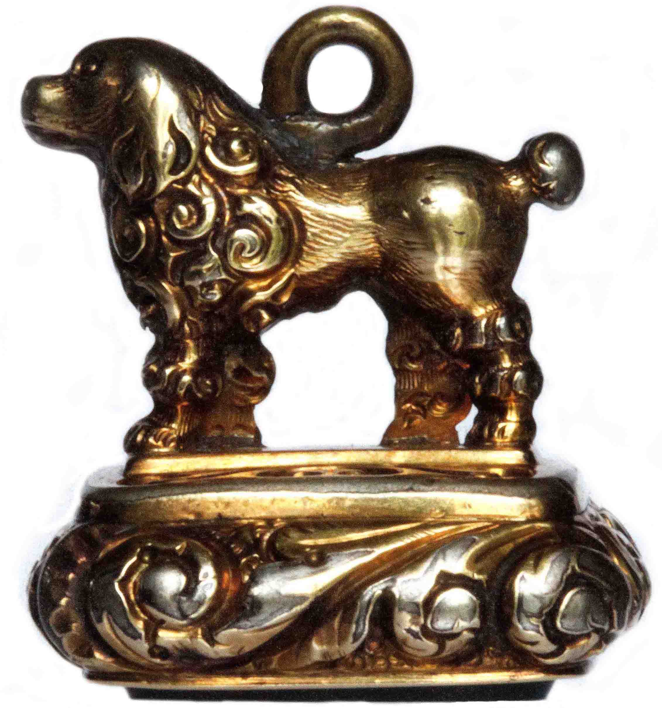 Click to see full size: Mid 19th century gilt seal of a standing Poodle in Lion Cut.  The dog stands on a plinth of scrolled design, and the agate seal bears the initial ?W?  English, circa 1850