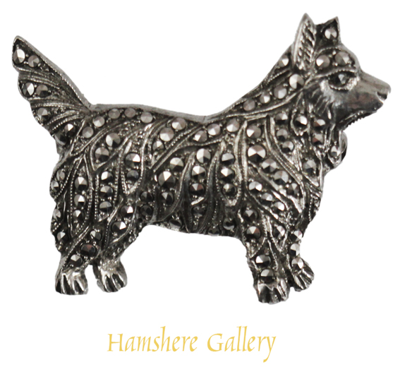 Click to see full size: Early 20th century silver set marcasite brooch of a Cairn Terrier