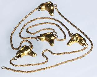 Click to see full size: Long necklace with a rich gold link chain interspersed with four dogs (L?vriers / Greyhounds)