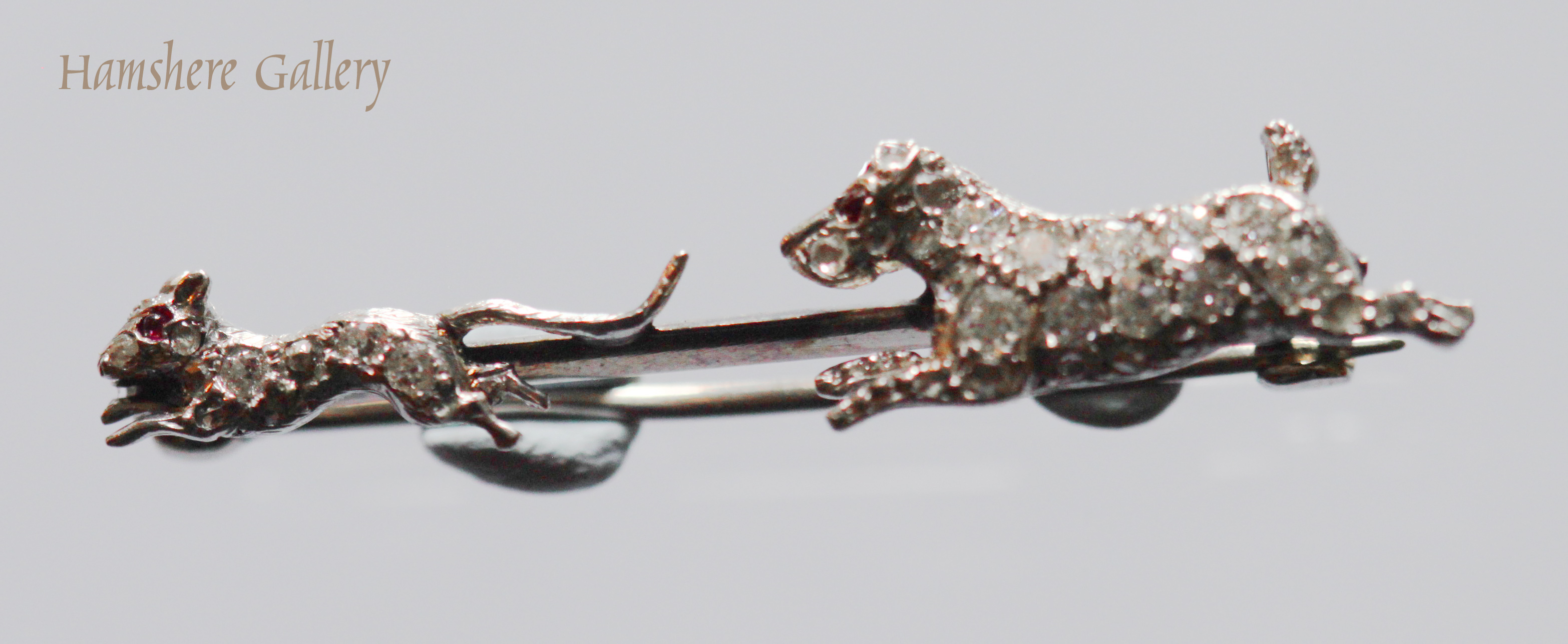 Click to see full size: Diamond Sealyham chasing rat brooch 