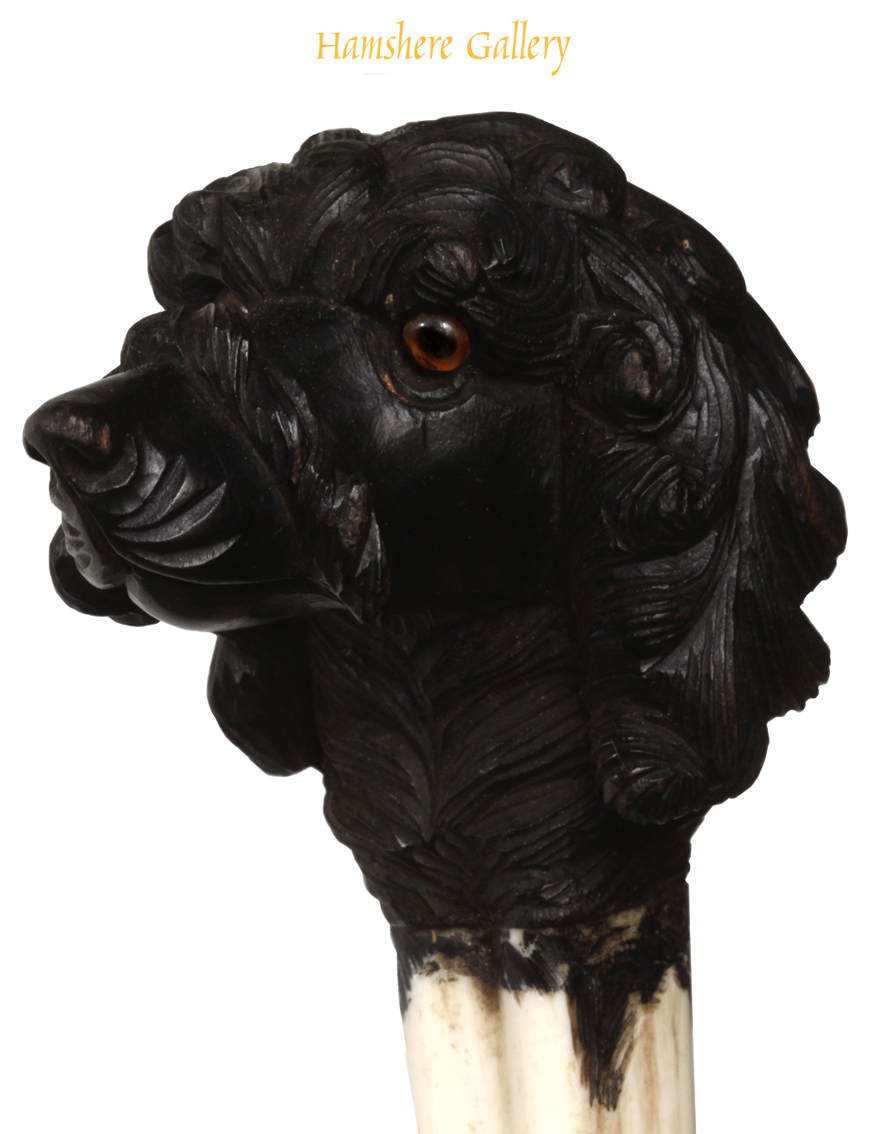Click to see full size: A late 19th century ebony and ivory Poodle cane.