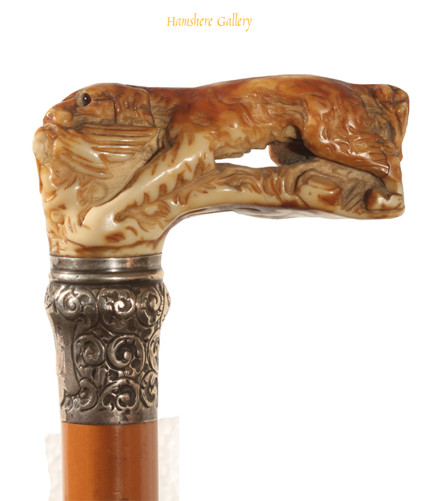 Click to see full size: A Victorian ivory handled Spaniel silver mounted walking cane