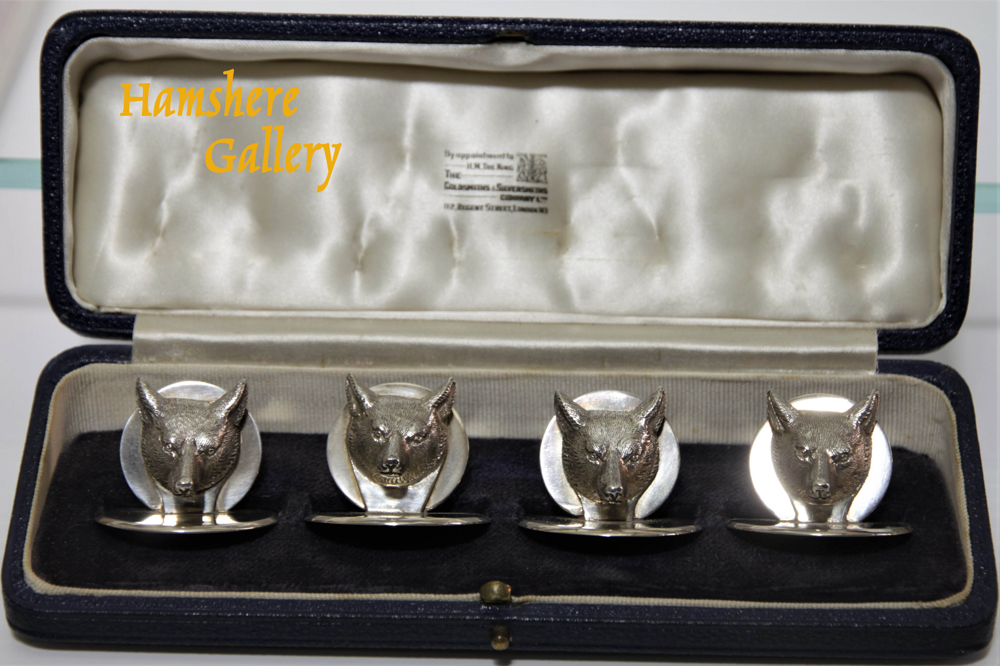 Click to see full size: Goldsmith & Silversmith boxed set of George V silver fox menu / place settings / card holders.