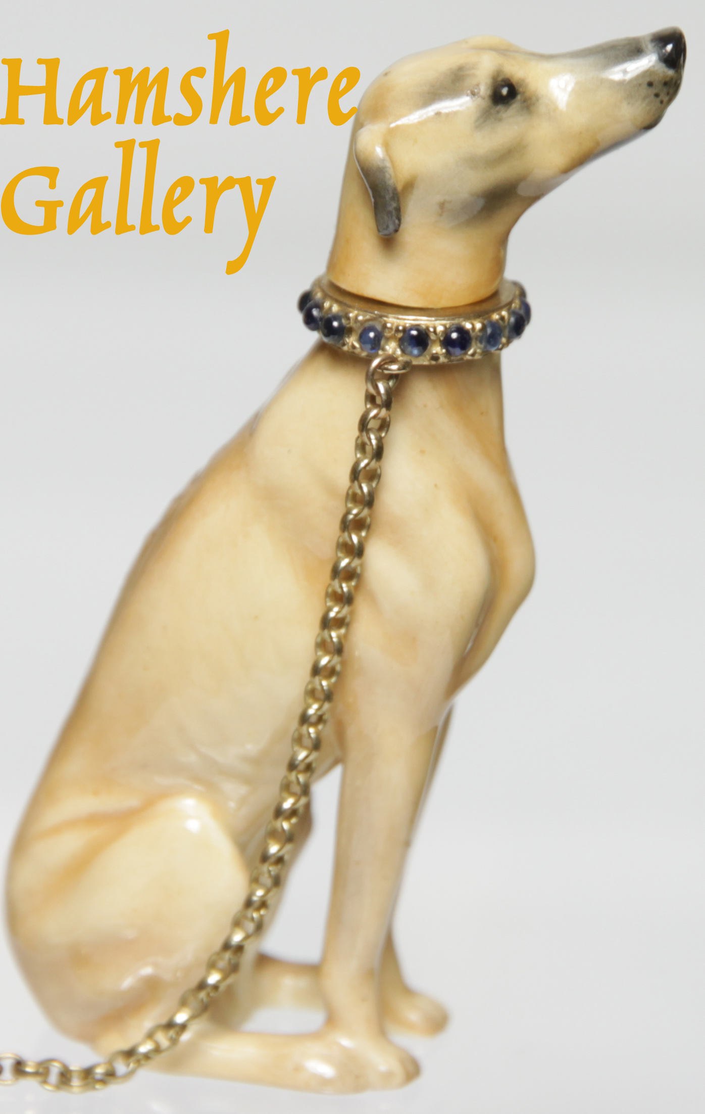 Click to see full size: A porcelain Greyhound gem set perfume flacon