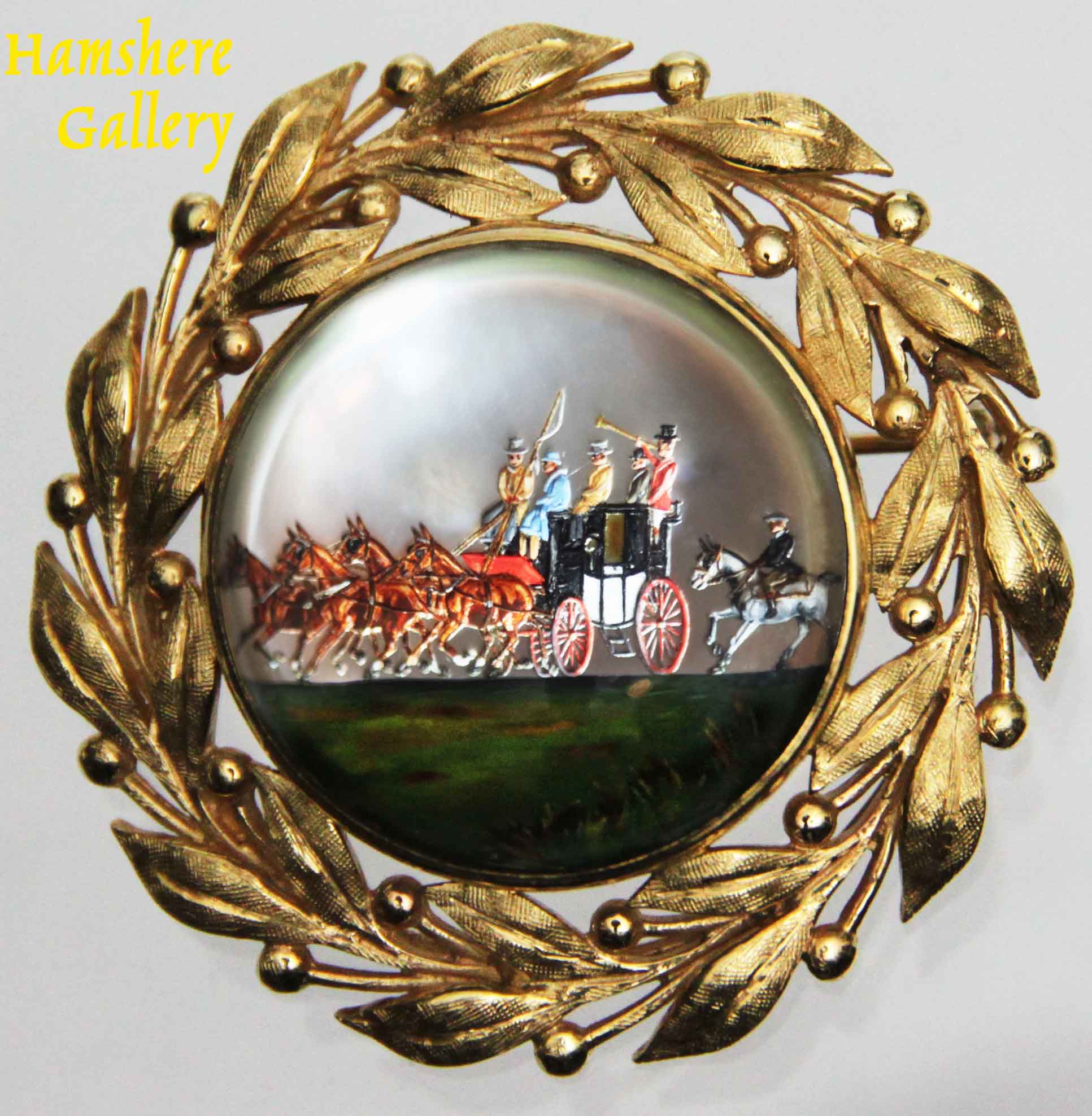 Click to see full size: Victorian reverse intaglio carriage / coaching / four-in-hand diamond and gold laurel leaf set crystal brooch- Victorian reverse intaglio carriage / coaching / four-in-hand diamond and gold laurel leaf set crystal brooch