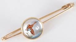 Click to see full size: French, circa 1910, 18 carat gold, reverse intaglio ‘Ruddy Shelduck’ crystal stock pin.